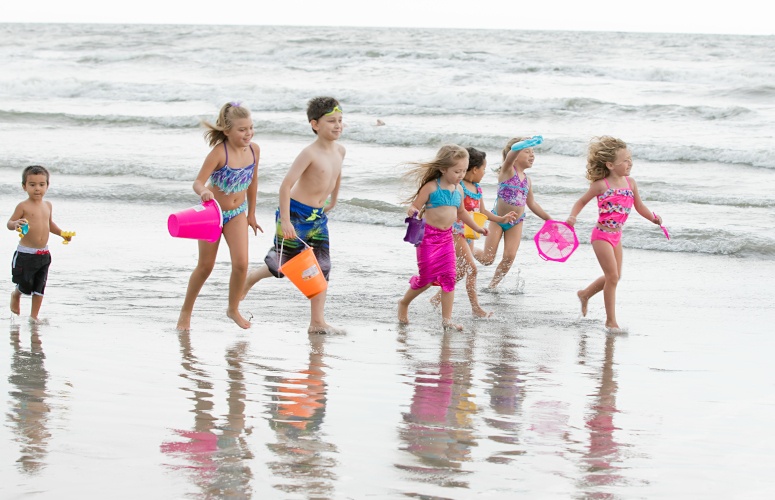 children running on a beach
